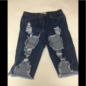 Ripped up Bermuda shorts.
